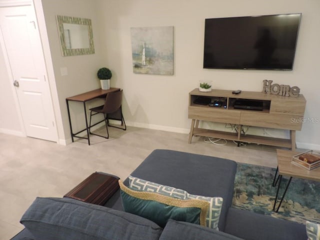 living room featuring baseboards