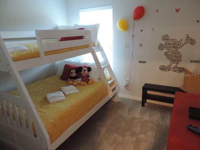 carpeted bedroom with baseboards