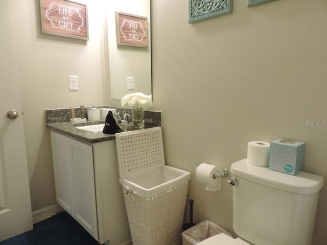 half bath with vanity and toilet