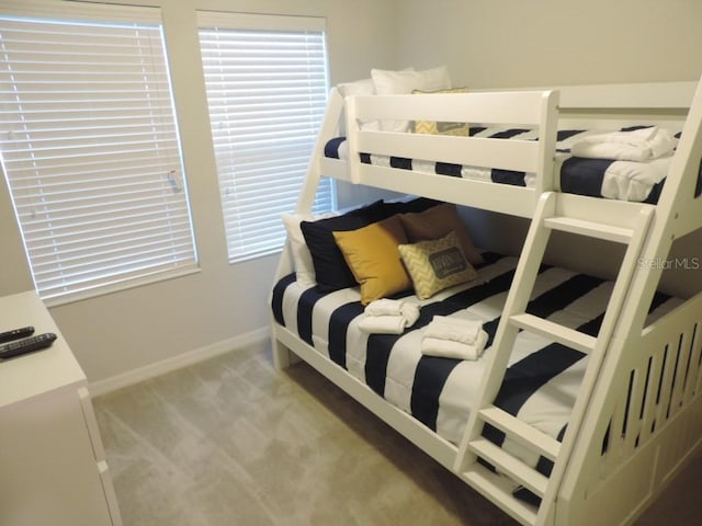 carpeted bedroom with baseboards