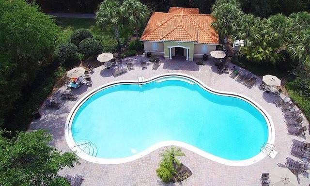 community pool with a patio area and a gazebo