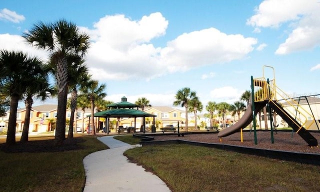 communal playground with a yard and a gazebo