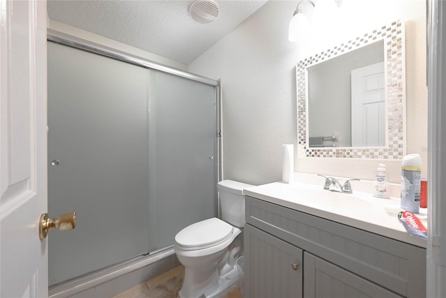 bathroom with vanity, a stall shower, tile patterned floors, toilet, and visible vents