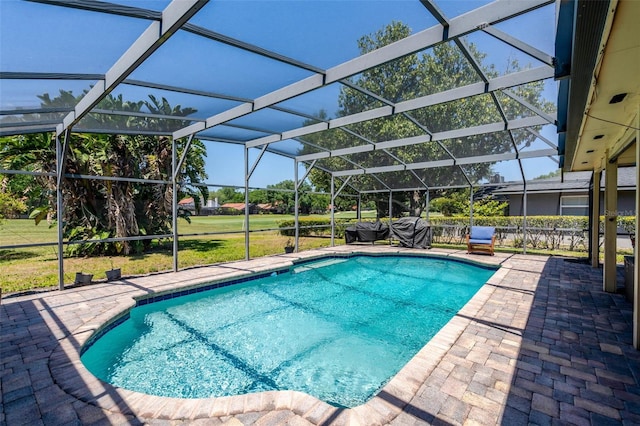 7655 Persian Ct, Orlando, FL 32819 - outdoor pool featuring a yard, a patio area, and glass enclosure