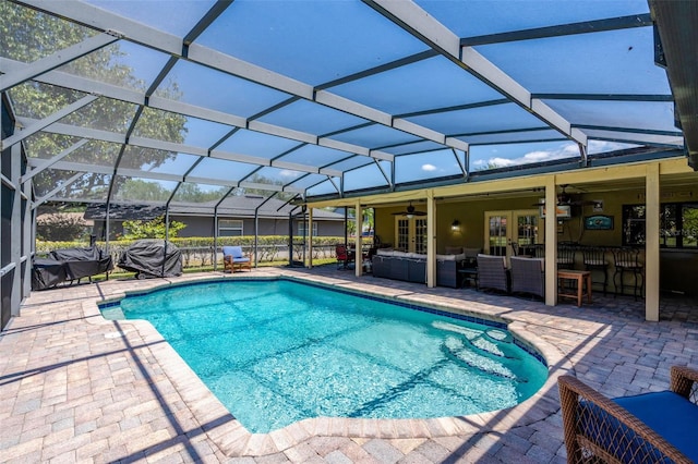 7655 Persian Ct, Orlando, FL 32819 - pool featuring an outdoor living space, a ceiling fan, a patio, and french doors
