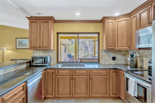 7655 Persian Ct, Orlando, FL 32819 - kitchen featuring dark stone countertops, a sink, brown cabinetry, stainless steel appliances, and backsplash