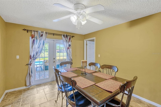 7655 Persian Ct, Orlando, FL 32819 - dining room with french doors, baseboards, a textured ceiling, and a ceiling fan