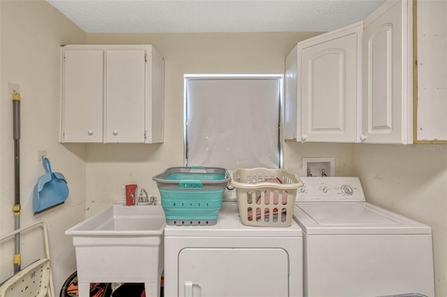 7655 Persian Ct, Orlando, FL 32819 - clothes washing area featuring a sink, washer and clothes dryer, and cabinet space