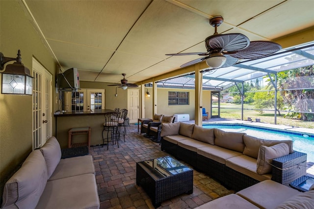 7655 Persian Ct, Orlando, FL 32819 - view of patio featuring outdoor dry bar, outdoor lounge area, a ceiling fan, and an outdoor pool