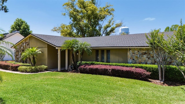 7655 Persian Ct, Orlando, FL 32819 - ranch-style home with stone siding, a front lawn, roof with shingles, and stucco siding