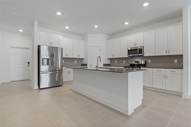 1908 Blissful Dr, Kissimmee, FL 34744 - kitchen featuring recessed lighting, backsplash, dark countertops, appliances with stainless steel finishes, and a sink
