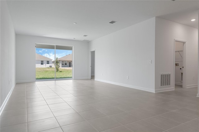 1908 Blissful Dr, Kissimmee, FL 34744 - spare room with visible vents, tile patterned floors, recessed lighting, and baseboards