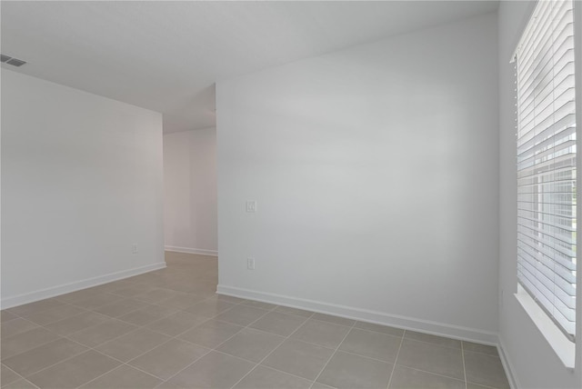1908 Blissful Dr, Kissimmee, FL 34744 - empty room featuring visible vents, baseboards, and light tile patterned flooring