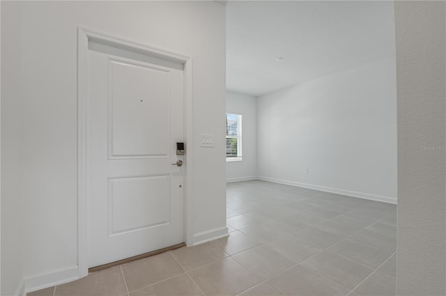 1908 Blissful Dr, Kissimmee, FL 34744 - foyer with light tile patterned floors and baseboards