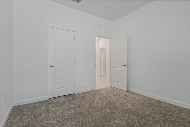 1908 Blissful Dr, Kissimmee, FL 34744 - unfurnished bedroom featuring baseboards and carpet