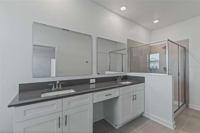 1908 Blissful Dr, Kissimmee, FL 34744 - full bathroom featuring a sink, tile patterned floors, and a stall shower