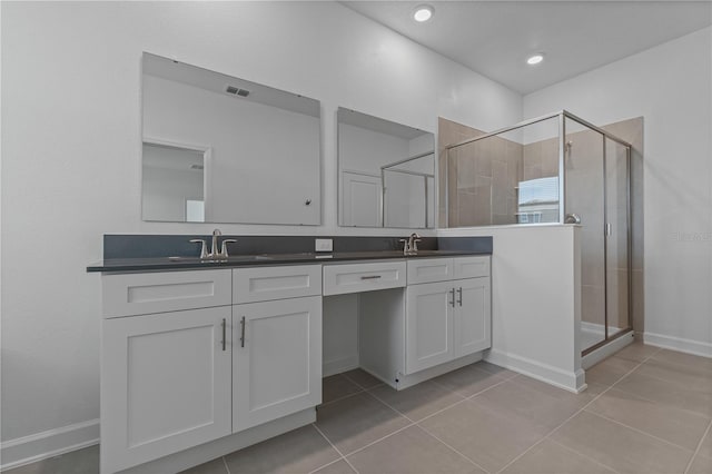 1908 Blissful Dr, Kissimmee, FL 34744 - full bathroom featuring a sink, visible vents, a shower stall, and tile patterned flooring