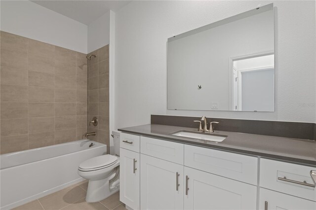 1908 Blissful Dr, Kissimmee, FL 34744 - full bath featuring tile patterned flooring, vanity, toilet, and tub / shower combination