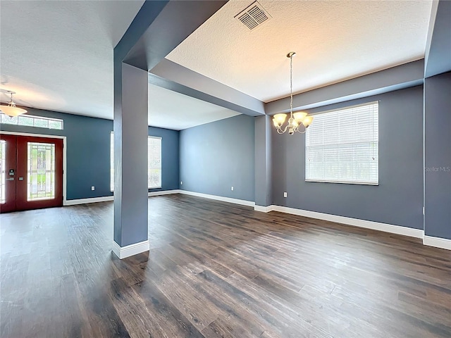 unfurnished dining area with plenty of natural light, visible vents, and baseboards