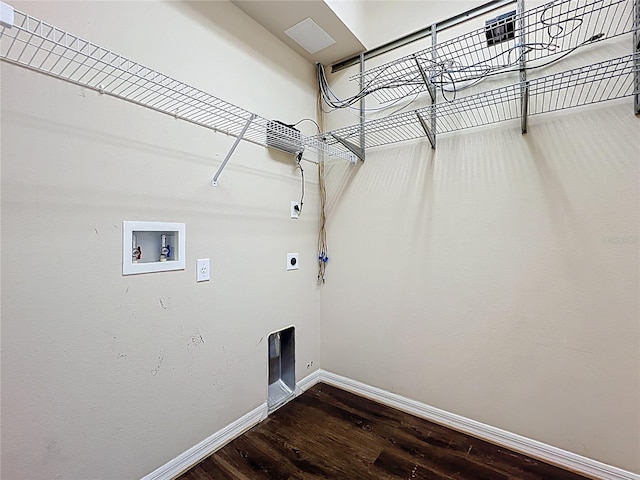 laundry area featuring laundry area, wood finished floors, baseboards, electric dryer hookup, and washer hookup