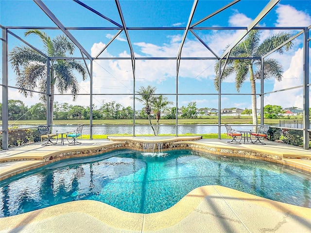 outdoor pool featuring a patio area and glass enclosure