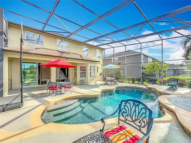 pool with a lanai, outdoor dining area, and a patio