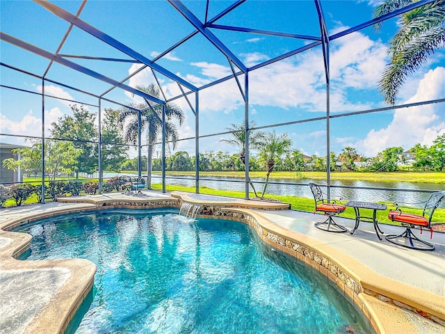 outdoor pool featuring a patio area, glass enclosure, and a water view
