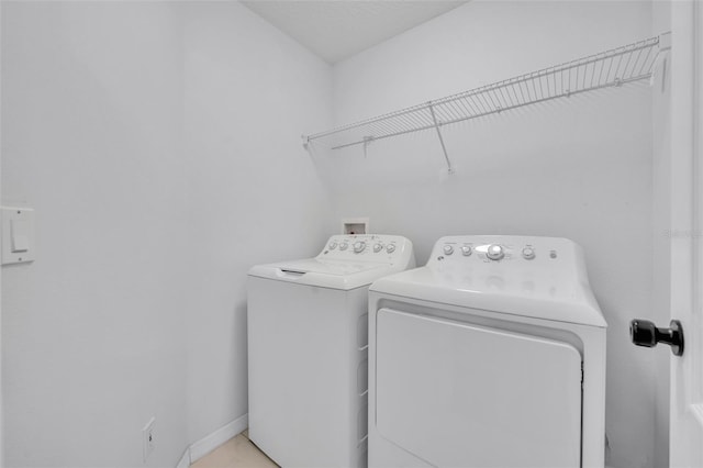 laundry area with laundry area and washing machine and clothes dryer