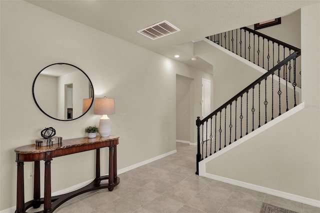 3259 Buoy Cir, Winter Garden, FL 34787 - interior space featuring baseboards, recessed lighting, stairway, light tile patterned floors, and visible vents