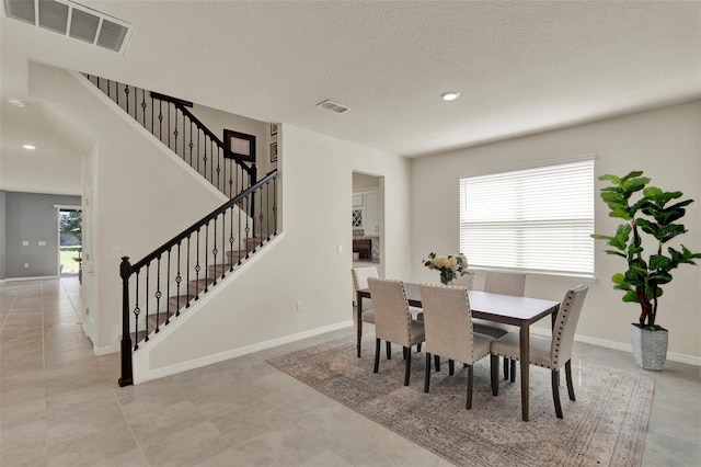 3259 Buoy Cir, Winter Garden, FL 34787 - dining area featuring baseboards, visible vents, and stairs