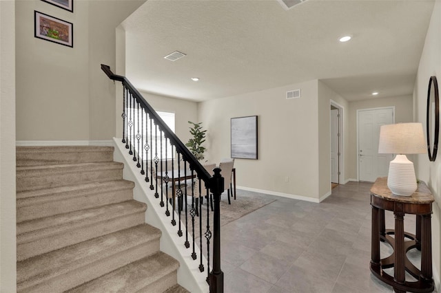 3259 Buoy Cir, Winter Garden, FL 34787 - stairway with recessed lighting, visible vents, and baseboards