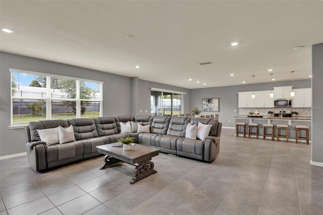 3259 Buoy Cir, Winter Garden, FL 34787 - living room with a healthy amount of sunlight, light tile patterned floors, and recessed lighting