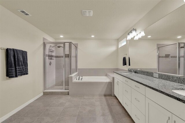 3259 Buoy Cir, Winter Garden, FL 34787 - bathroom with a shower stall, a bath, recessed lighting, tile patterned floors, and double vanity