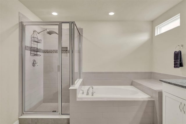 3259 Buoy Cir, Winter Garden, FL 34787 - bathroom with a shower stall, recessed lighting, vanity, and a bath