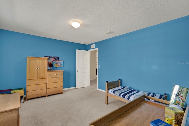 3259 Buoy Cir, Winter Garden, FL 34787 - bedroom featuring carpet flooring, visible vents, a textured ceiling, and baseboards