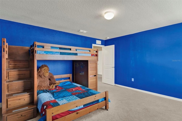 3259 Buoy Cir, Winter Garden, FL 34787 - bedroom with carpet floors, baseboards, visible vents, and a textured ceiling