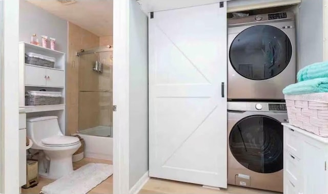 8800 Bay Pines Blvd Unit 306, Saint Petersburg, FL 33709 - laundry area with stacked washer / dryer and laundry area