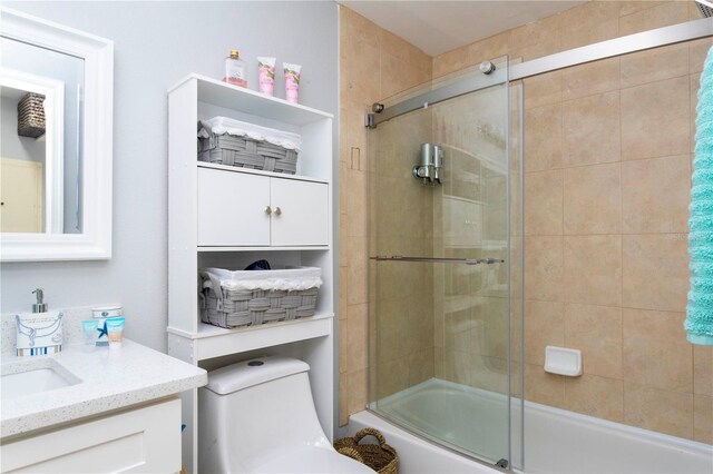8800 Bay Pines Blvd Unit 306, Saint Petersburg, FL 33709 - bathroom with combined bath / shower with glass door, vanity, and toilet