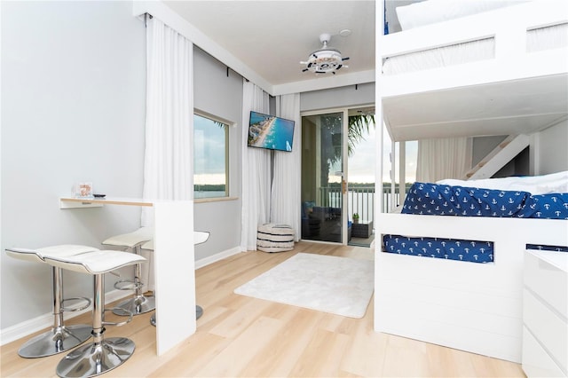 8800 Bay Pines Blvd Unit 306, Saint Petersburg, FL 33709 - interior space featuring wood finished floors, baseboards, and access to outside