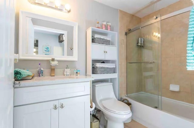 8800 Bay Pines Blvd Unit 306, Saint Petersburg, FL 33709 - bathroom featuring toilet, vanity, and enclosed tub / shower combo