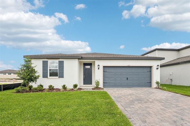 1752 Brekey Way, Zephyrhills, FL 33541 - view of front of property featuring stucco siding, decorative driveway, and a front lawn