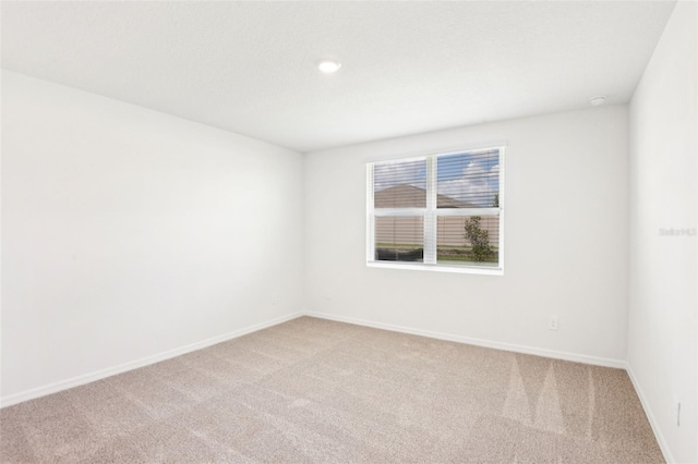 1752 Brekey Way, Zephyrhills, FL 33541 - unfurnished room with light colored carpet