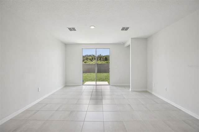 1839 Brekey Way, Zephyrhills, FL 33541 - unfurnished room featuring light tile patterned floors, baseboards, and a textured ceiling