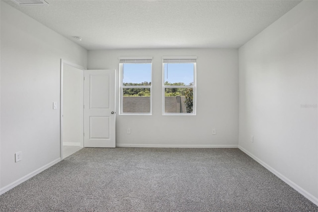 1839 Brekey Way, Zephyrhills, FL 33541 - unfurnished room featuring carpet flooring, a textured ceiling, and baseboards