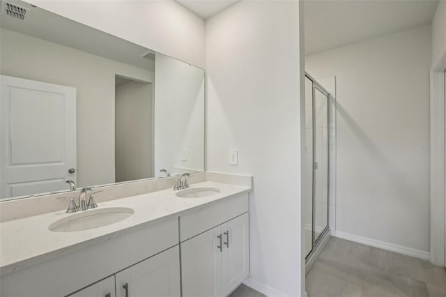 1839 Brekey Way, Zephyrhills, FL 33541 - full bathroom with double vanity, a shower stall, and baseboards