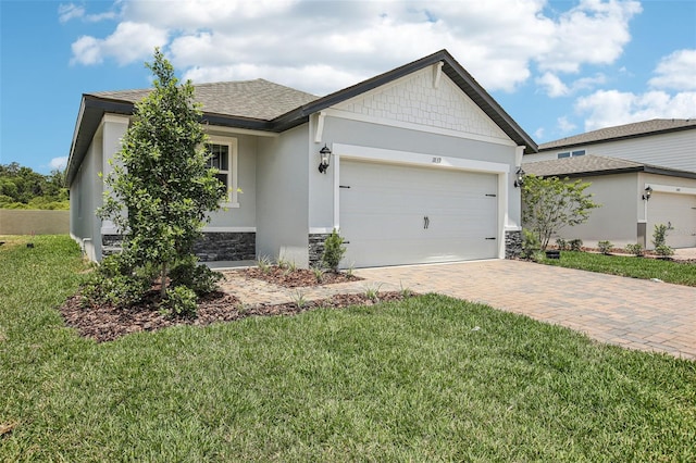 1839 Brekey Way, Zephyrhills, FL 33541 - single story home with stone siding, a garage, stucco siding, decorative driveway, and a front lawn