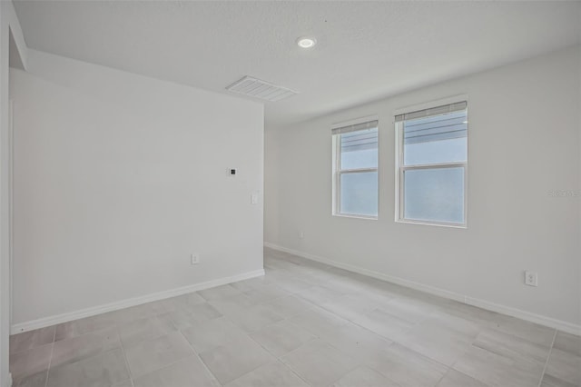 1839 Brekey Way, Zephyrhills, FL 33541 - empty room featuring baseboards and recessed lighting