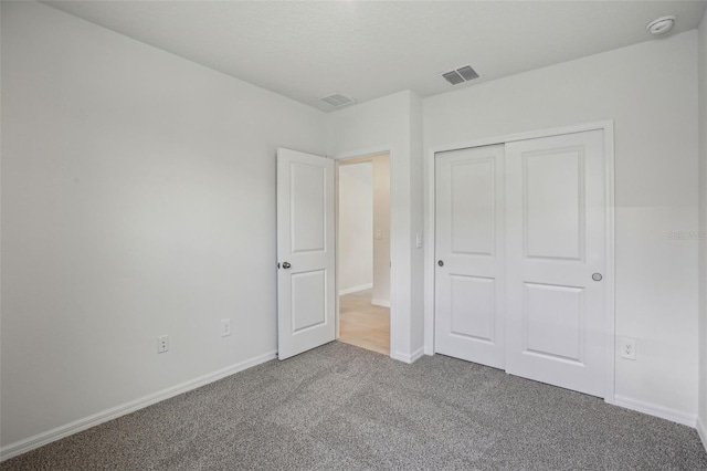 1839 Brekey Way, Zephyrhills, FL 33541 - unfurnished bedroom with carpet flooring, baseboards, and a closet