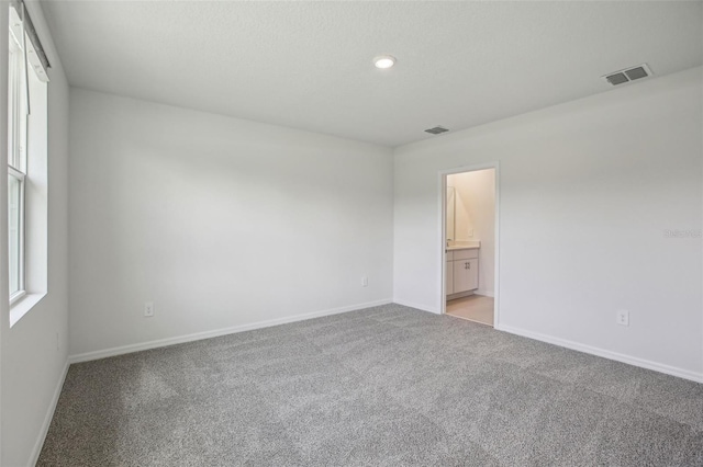 1839 Brekey Way, Zephyrhills, FL 33541 - unfurnished room with light colored carpet, baseboards, and recessed lighting