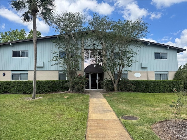 1695 Lee Rd Unit E214, Winter Park, FL 32789 - view of front of home featuring a front yard and brick siding